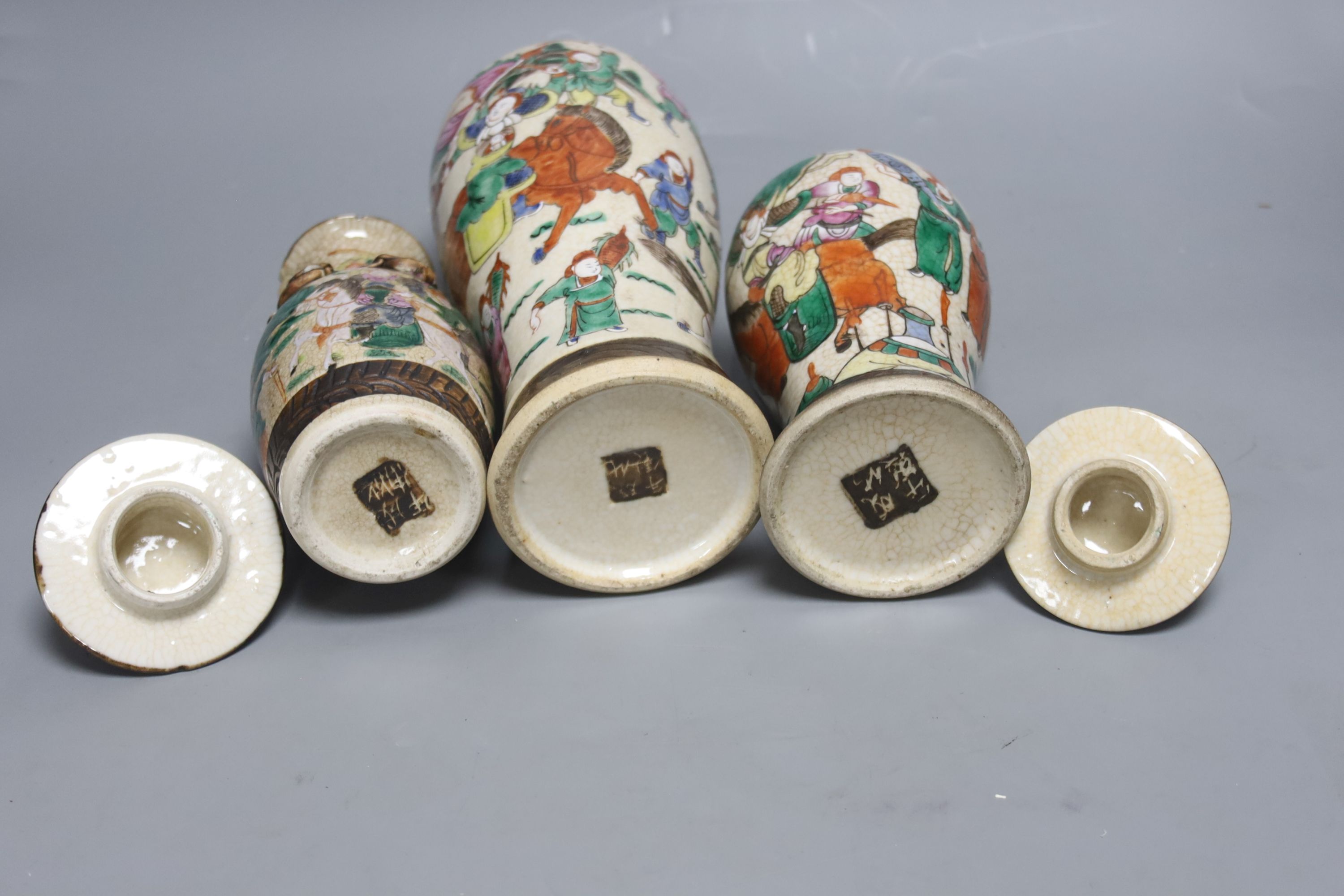 Three early 20th century Chinese crackle glaze vases, two with covers, tallest 33.5cm